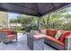 Outdoor seating with grill offers an inviting space for entertaining in a backyard setting at 911 Hunt Club, Charleston, SC 29414