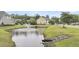 A tranquil pond with a fountain enhances the community's beauty and provides a peaceful retreat at 911 Hunt Club, Charleston, SC 29414