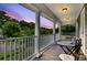 Inviting porch with stylish table and chairs, perfect for enjoying outdoor views and a peaceful atmosphere at 911 Hunt Club, Charleston, SC 29414