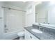 Spotless bathroom with shower and tub combo, granite countertop, and white cabinets at 977 Warrick Oaks Ln, Mount Pleasant, SC 29464