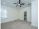 Bright bedroom featuring a ceiling fan, neutral carpet, white walls, and access to an ensuite bathroom at 977 Warrick Oaks Ln, Mount Pleasant, SC 29464