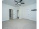 Large bedroom offering plush carpeting, two doorways, and a ceiling fan for added comfort at 977 Warrick Oaks Ln, Mount Pleasant, SC 29464