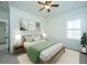 Cozy bedroom with a ceiling fan, queen bed, and neutral colored walls at 977 Warrick Oaks Ln, Mount Pleasant, SC 29464