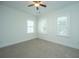 Bedroom with neutral walls, large windows, and a ceiling fan at 977 Warrick Oaks Ln, Mount Pleasant, SC 29464