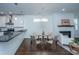 Dining room featuring a round table with seating, a fireplace, and an eat-in kitchen at 977 Warrick Oaks Ln, Mount Pleasant, SC 29464