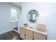 Bright entryway features a modern lamp, round mirror, and woven cabinet at 977 Warrick Oaks Ln, Mount Pleasant, SC 29464