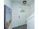 Inviting entryway with tiled floors, white trim, fresh paint, and light fixture at 977 Warrick Oaks Ln, Mount Pleasant, SC 29464