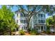 Beautiful home featuring traditional siding, mature trees, and manicured landscaping, enhancing curb appeal at 977 Warrick Oaks Ln, Mount Pleasant, SC 29464
