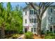 Charming home with traditional siding, mature trees, and manicured landscaping, creating inviting curb appeal at 977 Warrick Oaks Ln, Mount Pleasant, SC 29464