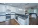 Open kitchen with granite countertops, stainless appliances, and a seamless flow to the living space at 977 Warrick Oaks Ln, Mount Pleasant, SC 29464