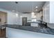Bright kitchen showcases stainless steel appliances, sleek granite countertops, and stylish pendant lights at 977 Warrick Oaks Ln, Mount Pleasant, SC 29464