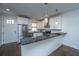 Well-lit kitchen featuring stainless steel appliances, granite countertops, and white cabinets at 977 Warrick Oaks Ln, Mount Pleasant, SC 29464