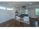 Cozy living room with fireplace, ceiling fan and two white arm chairs at 977 Warrick Oaks Ln, Mount Pleasant, SC 29464