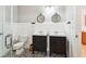 Modern bathroom featuring double vanity sinks with dark cabinets and decorative tile flooring at 1007 Whitlow Blvd, Summerville, SC 29483