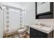 Bathroom featuring decorative shower curtain, vanity with cabinet, and wood-look floors at 1007 Whitlow Blvd, Summerville, SC 29483