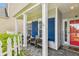 Charming front porch featuring comfortable seating, decorative shutters, and a welcoming entrance at 1007 Whitlow Blvd, Summerville, SC 29483