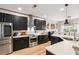 Modern kitchen boasts stainless steel appliances, white countertops, and dark cabinets at 1007 Whitlow Blvd, Summerville, SC 29483