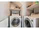 Convenient laundry room with washer and dryer and shelving at 1007 Whitlow Blvd, Summerville, SC 29483