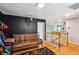Spacious game room with Mortal Kombat arcade game and a futon for seating at 1007 Whitlow Blvd, Summerville, SC 29483