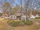 Aerial view of a two-story home surrounded by mature trees and greenery highlighting its curb appeal and landscaping at 101 Plantation Dr, Summerville, SC 29485