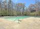 Community pool with clear blue water, handrails, and a concrete deck for residents to enjoy swimming at 101 Plantation Dr, Summerville, SC 29485