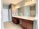 Elegant bathroom featuring double sinks, wooden cabinets, large mirror and modern lighting at 115 Hyrne Dr, Goose Creek, SC 29445