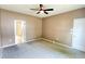 Bedroom with ceiling fan, carpet flooring, neutral paint, and white doors and trim at 115 Hyrne Dr, Goose Creek, SC 29445