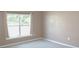 Bright bedroom featuring a window with curtains and neutral walls and flooring at 115 Hyrne Dr, Goose Creek, SC 29445