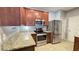 Modern kitchen with stainless steel appliances, granite countertops, and warm wood cabinets at 115 Hyrne Dr, Goose Creek, SC 29445