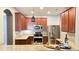 Modern kitchen features granite counters, stainless steel appliances, and dark wood cabinetry at 115 Hyrne Dr, Goose Creek, SC 29445