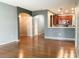 Open-concept layout featuring hardwood floors and a view of the kitchen with granite countertops at 115 Hyrne Dr, Goose Creek, SC 29445