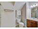 Compact bathroom featuring a single vanity, toilet, and shower with clean lines and practical design at 116 Venezia Ct, Ladson, SC 29456