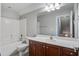 Clean bathroom featuring a vanity with dark wood cabinets, a large mirror, and a shower/tub combo at 116 Venezia Ct, Ladson, SC 29456
