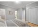 Clean bedroom featuring gray walls, white trim, and multiple closets, offering ample storage solutions at 116 Venezia Ct, Ladson, SC 29456