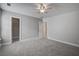 Neutral bedroom with a ceiling fan, walk-in closet, and doorways to other rooms at 116 Venezia Ct, Ladson, SC 29456