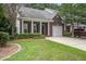 Charming brick townhome with manicured landscaping, covered porch, and a one-car garage at 116 Venezia Ct, Ladson, SC 29456