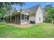 Spacious two-story home with a screened porch and lush green lawn at 116 Venezia Ct, Ladson, SC 29456