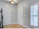 Entryway hall featuring bright light, hardwood floors, and access to multiple rooms in the home at 116 Venezia Ct, Ladson, SC 29456