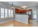 Cozy kitchen and dining area featuring white plantation shutters, stainless steel appliances, and wood cabinetry at 116 Venezia Ct, Ladson, SC 29456