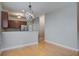 Open concept kitchen with stainless steel appliances and breakfast bar overlooking the dining area at 116 Venezia Ct, Ladson, SC 29456