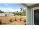An expansive backyard with newly planted landscaping and a view of a neighboring house at 117 Mims Academy Dr, Harleyville, SC 29448