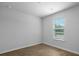 Bedroom with hardwood floors, a window, and neutral paint at 119 Mims Academy Dr, Harleyville, SC 29448