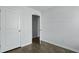 Bright bedroom with hardwood floors and a partially open closet door at 119 Mims Academy Dr, Harleyville, SC 29448