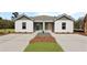 Attractive duplex with separate entrances, enhanced by a professionally designed yard at 119 Mims Academy Dr, Harleyville, SC 29448