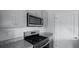 Kitchen featuring stainless steel appliances, granite countertops, and gray cabinetry at 119 Mims Academy Dr, Harleyville, SC 29448