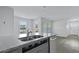 Kitchen with stainless steel dishwasher and sink, granite countertops, gray cabinets, and wood-look floors at 119 Mims Academy Dr, Harleyville, SC 29448