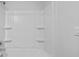 Bright bathroom with a shower featuring built-in shelves at 119 Mims Academy Dr, Harleyville, SC 29448
