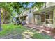 Backyard with a screened-in porch and brick patio at 1201 Pine Bluff Dr, Summerville, SC 29483