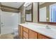 Bathroom with double sink vanity, tub-shower, and framed mirrors at 1201 Pine Bluff Dr, Summerville, SC 29483