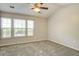 This bedroom is spacious and well-lit, offering a comfortable retreat with three large windows at 1201 Pine Bluff Dr, Summerville, SC 29483